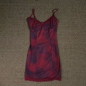 I am Gia pink and purple dress. Like new. XS